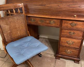 Roll Top Desk and cane back rolling chair