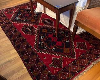 one of many rugs, bench,