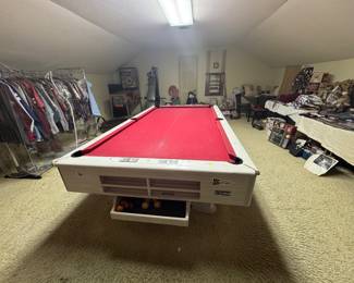 Nice pool table with balls and pool ques 