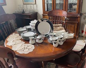 Mikasa China and wood dining table with two leaves