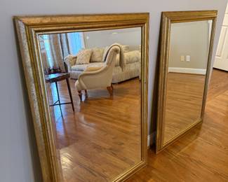 Pair of designer gold mirrors 