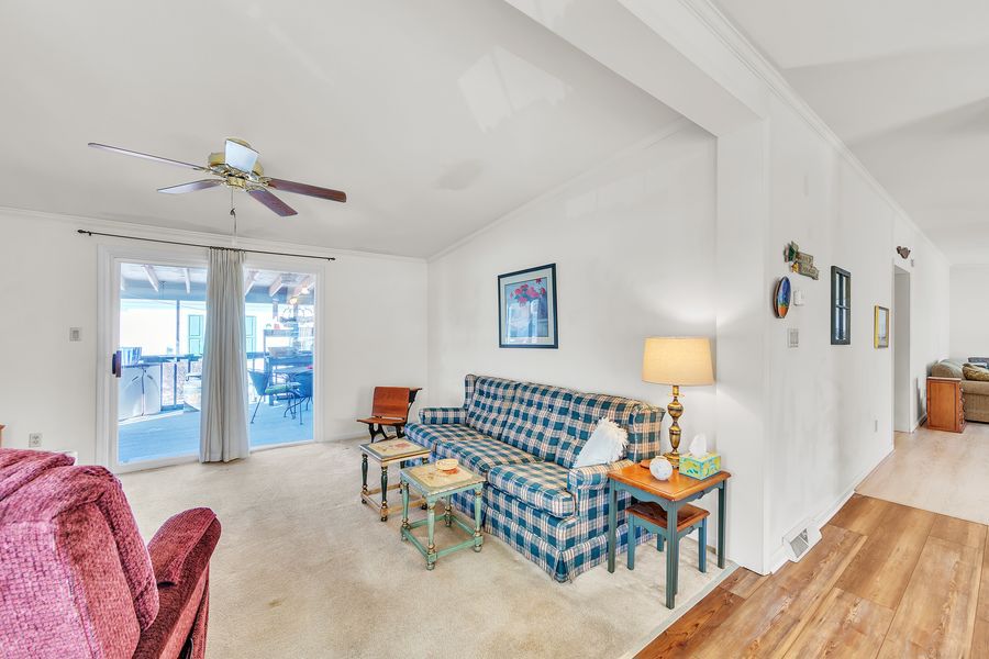 Couch, end tables, lamp, school desk