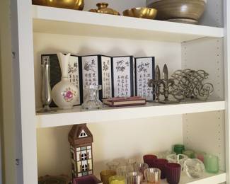various candles, bookends, vases