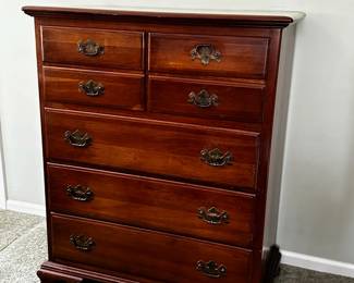 This is the taller of the two dressers. Solid Cherry. 3 long drawers. 4 smaller drawers. 