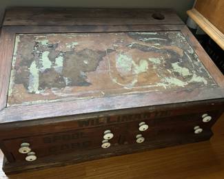 Antique spool cabinet with slant top desk/ink holder