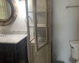 #99 - $150 - Tall bathroom cabinet 3 glass shelves opened on each side. 