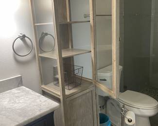 #99 - $150 - Tall bathroom cabinet 3 glass shelves opened on each side. 