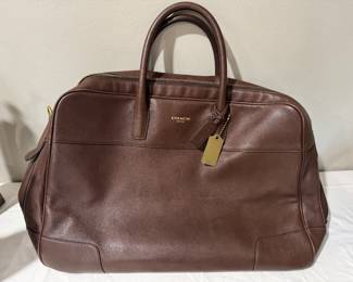 #114 - $180 - Coach leather brown bowling travel bag 