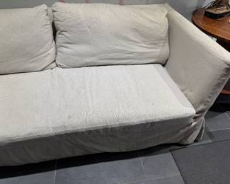 #61 - $400. - Duh sofa, linen, down pillows. 