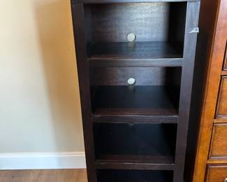 #53 black bookcase/entertainment center, 3 shelves 20x16x48 $75.00