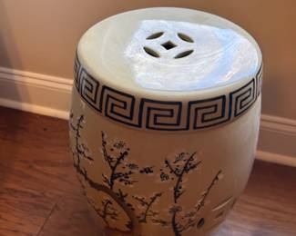 #28 ceramic drum table with cherry blossoms painted on it, 10x18 $100.00