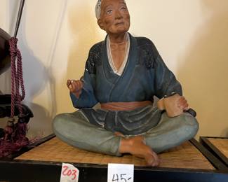 #203 mudman sitting, 9" tall $45.00