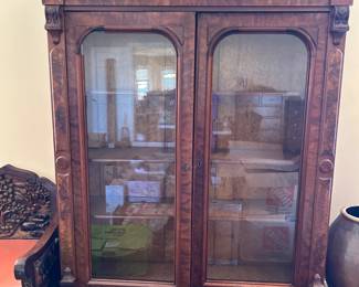 #43 heavy burled wood display cabinet with 2 glass doors and 3 wood shelves, carved column, as is - missing corner mounding 56x18x72 $250.00