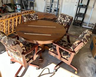#97 round pedestal table with claw feet with 4 rolling chairs with cigars and pipes pattern 45x28 $200.00