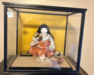 #139 Asian porcelain doll with accessories in glass case 16x16x14 $40.00
