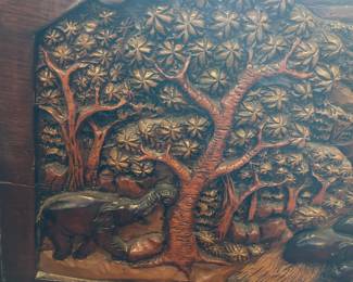 #39 4 chairs from Japan with loose cushions, hand carved back with elephants, 27"x 25" $400.00