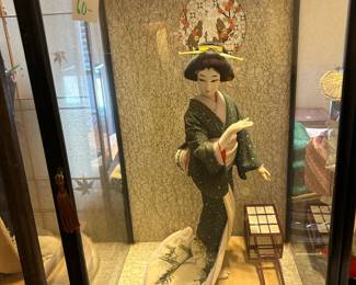 #143 Asian geisha doll, 15" tall, green kimono in black wood and glass case 14x13x23 $60.00