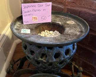 #133 Japanese cast iron garden planter on wheels $50.00