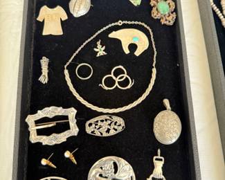 Sterling jewelry brooches...