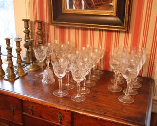 Assorted antique brass candlesticks & crystal stemware