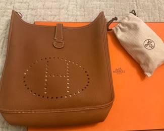 Hermes Taurillon Clemence Evelyne Shoulder Bag in Gold - Priced at $5,000 - new reduced price$2,850
Gold Handle- Strap
Leather Shoulder Straps
Leather Lining
Zip Closer 
Estimated item measurements 
Shoulder- Strap drop: 24”
Height: 13”
Width: 13”
Depth: 3.5”