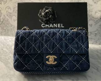 Chanel denim priced at $4,750 - new reduced price  pre-owned - never used                                                                                                 Chanel blue denim shoulder bag
From the Cruise 2020 Collection by Virginie Viard
Gold- Tone Hardware
Chain- Link Shoulder Straps
Canvas Lining
Turn- Lock Closure at Front 