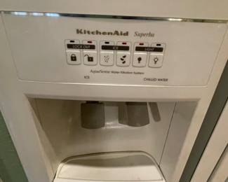 Kitchen aide white refrigerator with water and ice dispenser in door