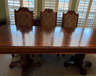 Large dining table with 8 chairs.