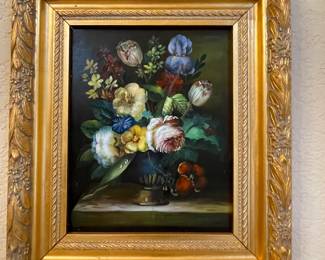 Painting of flowers in gold frame