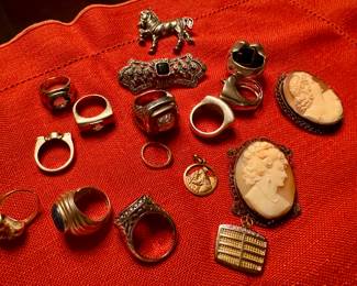 Several pieces of gold, sterling jewelry