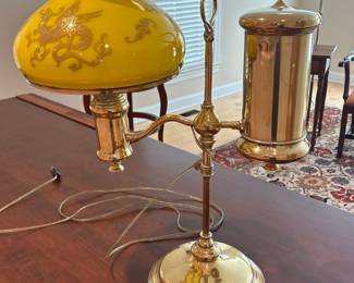 brass electrified oil lamp with gold lions on shade 