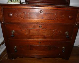 Large 3 drawer chest with drop original hardware. This is one that we think would be good to paint. Upstairs.