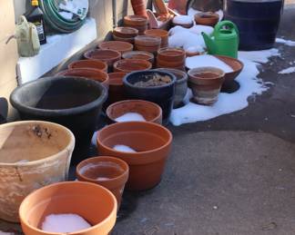 Pots for planting, in the driveway.