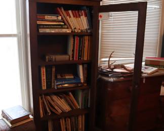 Oak bookcase and a varied collection of books. Upstairs in the office.