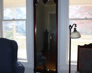 Elegant, narrow pier mirror in the front entrance room.