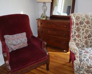 Simple 3 drawer chest in back with an English antique mirror above, in the living room.