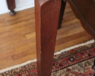 The square leg with a taper to it; on the Butler's desk in the lower staircase room.