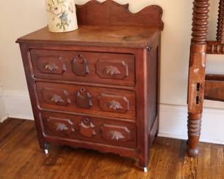 Victorian wash stand with 3 drawers and acorn handles, in the bedroom with all of the beds.