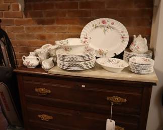 3 drawer antique chest in the rear entrance space.