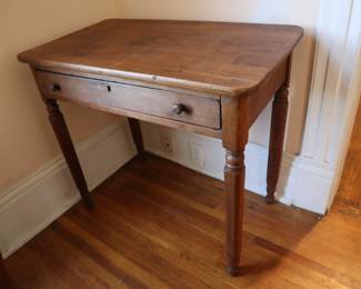 Table with one drawer, one of the pieces of furniture made with the square legs. In the staircase room downstairs.