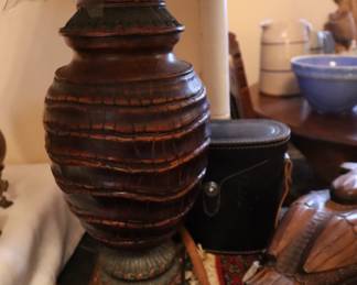 Lamp made with reptile skin look on large military trunk in the lower staircase room.