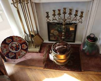 Large Imari plate, fireplace tools, large brass Menorah, wonderful piece of Fulper. painting, small rug, brass pot of pinecones, in the front entrance room.