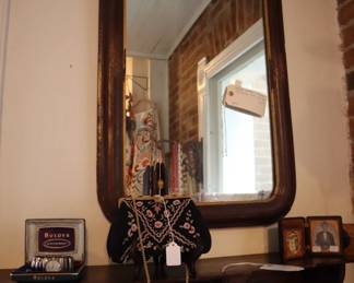 English Victorian shelf and English antique mirror. In jewelry area.