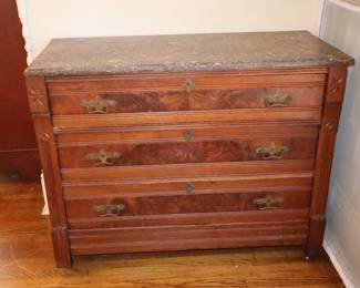 Wide, 3 drawer chest with granite-like piece on top, upstairs in the master bedroom.
