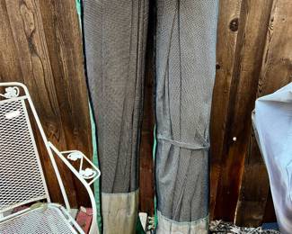 2 NICE QUALITY BAGGED MESH UMBRELLAS.