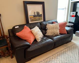 CONTEMPORARY LEATHER SOFA WITH UGG FEATHER DOWN PILLOWS.