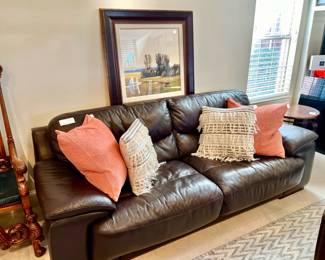 LOTS OF BEAUTIFUL FURNITURE AND PILLOWS.