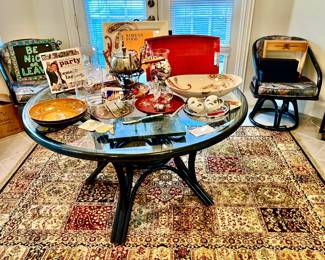 VINTAGE BLACK RATTAN GLASS TOP TABLE WITH 4 SWIVEL CHAIRS.  