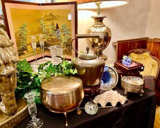 BRASS, CRYSTAL, AND SHELLS MIX GREAT WITH ASIAN DECOR.