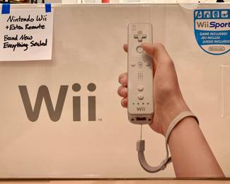 Nintendo Wii w/extra remote , STILL SEALED